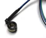Small black ferrite choke clamped around a blue and black cable to suppress electromagnetic interference (EMI).